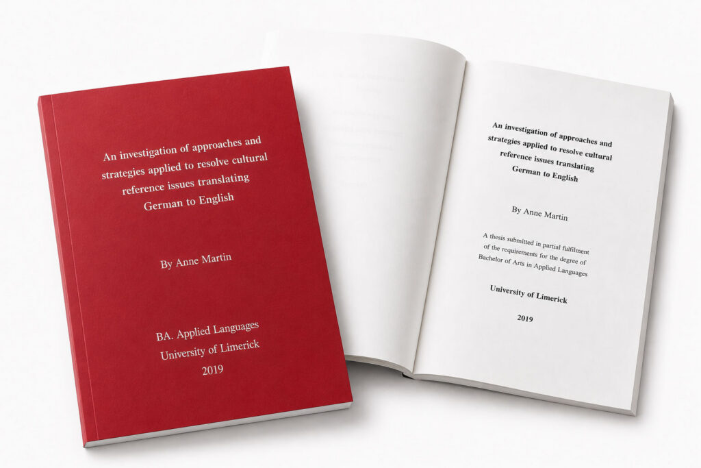 Asoft bound A4 thesis with a red cover and whiet text