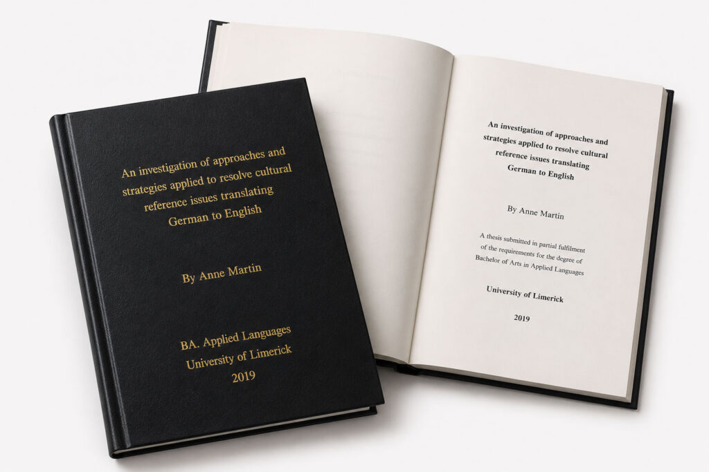 A hard bound A4 thesis with a black cover and gold embossed text